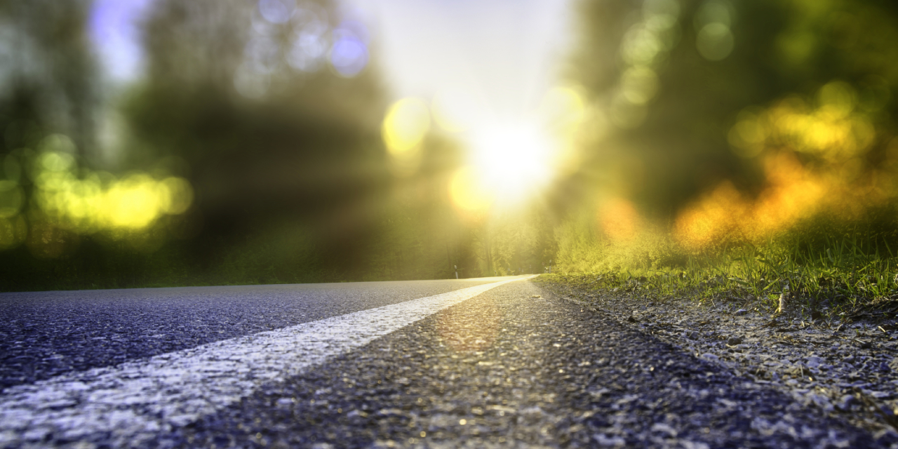 Closeup image of road during sunrise