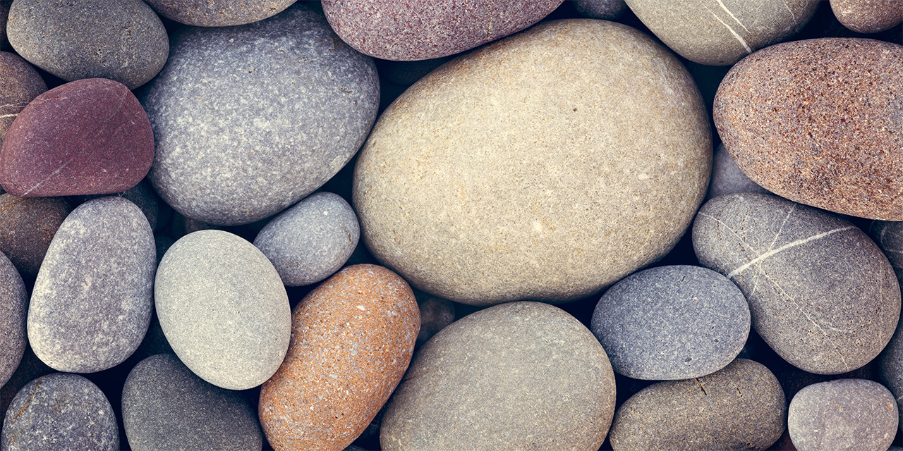 A group of multi-colored smooth stones