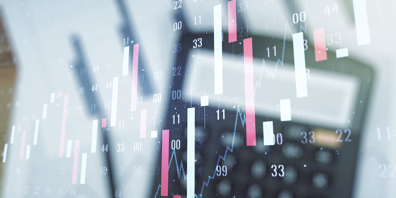 Double exposure image - calculator and financial chart.