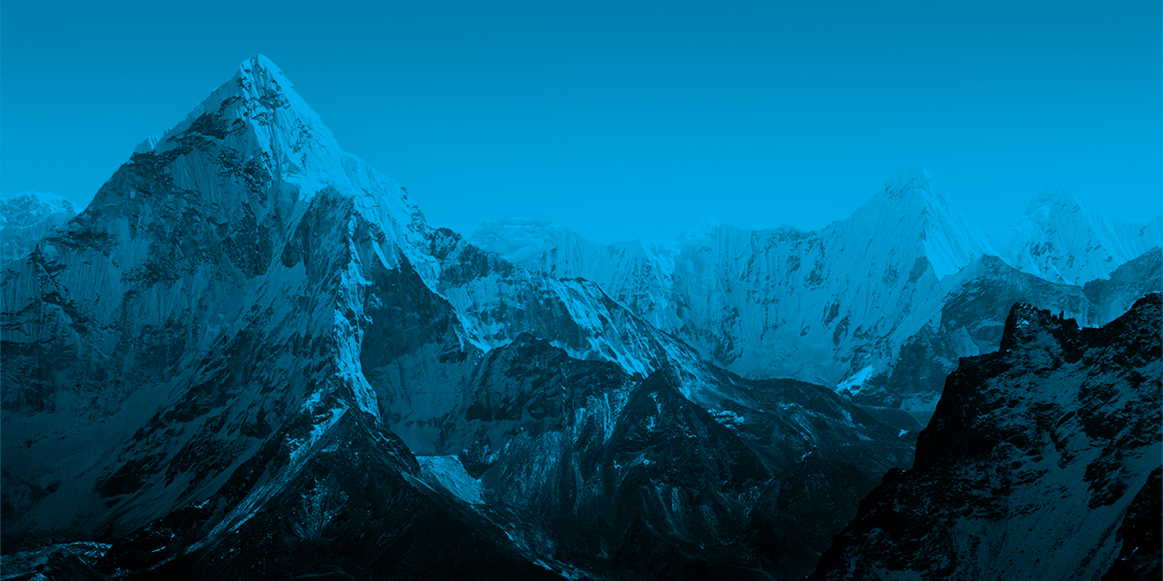 Styled photo of a mountain landscape overlaid with a translucent blue color